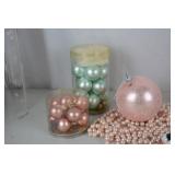 Collection of Pink and Pastel Christmas Ornaments and Santa Figurines