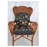 Wicker Armchair with Embroidered Floral Cushions
