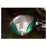 Cobra golf bag with assorted golf clubs