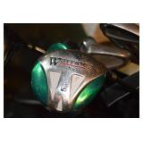 Cobra golf bag with assorted golf clubs