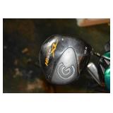 Cobra golf bag with assorted golf clubs