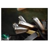 Cobra golf bag with assorted golf clubs