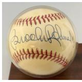Brooks Robinson Autographed Baseball With 1975 Topps Baseball Card On Stand