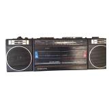 Shop supplies lot includes overhead lights, a display sled, a wire basket, a vintage boom box, and chairs.