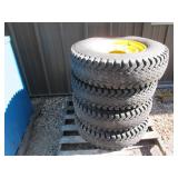 4 Wolf Paws Skid loader tires on 8 ...