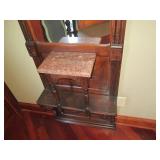 Ornately framed wall mirror with ma...