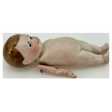 Pair of Antique Bisque Jointed Dolls including Kewpie