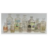Collection of 12 Antique Glass Water Slide Bottles with Original Labels