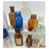 Collection of 25 Vintage Glass Bottles in Assorted Styles and Colors