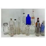 Collection of 18 Vintage and Antique Glass Bottles Assorted Colors and Shapes