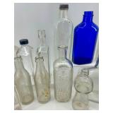 Collection of 18 Vintage and Antique Glass Bottles Assorted Colors and Shapes