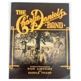 Book Lot: Who Was Who in World War II, Charlie Daniels Band Songbook, and Prince Gardner Wallet