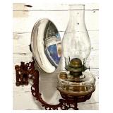 Antique Wall-Mounted Kerosene Oil Lamp with Reflector and Ornate Cast Iron Bracket
