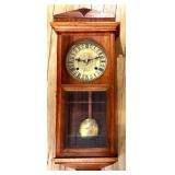 Antique Wood Case Wall Clock with Brass Pendulum and Roman Numeral Dial