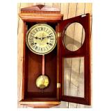 Antique Wood Case Wall Clock with Brass Pendulum and Roman Numeral Dial