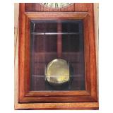 Antique Wood Case Wall Clock with Brass Pendulum and Roman Numeral Dial