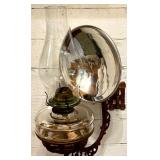 Antique Wall-Mounted Kerosene Oil Lamp with Reflector and Ornate Cast Iron Bracket