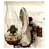 Antique Wall-Mounted Kerosene Oil Lamp with Reflector and Ornate Cast Iron Bracket