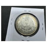 1885 Morgan Silver Dollar Marked AU When Purchased