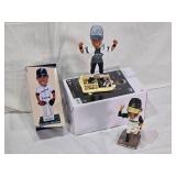 Lot of 3 Russell Wilson Bobblehead Figures including a Super Bowl Win Figure, Grizzlies and Dust Devils