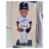 Lot of 3 Russell Wilson Bobblehead Figures including a Super Bowl Win Figure, Grizzlies and Dust Devils