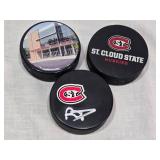 Ryan Poehling Autographed St. Cloud State Huskies Hockey Puck with 2 other Pucks including NCHC Official Game Puck and Herb Brooks National Hockey Center Commemorative Puck