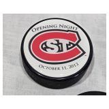 Ryan Poehling Autographed St. Cloud State Huskies Hockey Puck with 2 other Pucks including NCHC Official Game Puck and Herb Brooks National Hockey Center Commemorative Puck