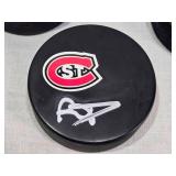 Ryan Poehling Autographed St. Cloud State Huskies Hockey Puck with 2 other Pucks including NCHC Official Game Puck and Herb Brooks National Hockey Center Commemorative Puck