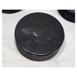 Ryan Poehling Autographed St. Cloud State Huskies Hockey Puck with 2 other Pucks including NCHC Official Game Puck and Herb Brooks National Hockey Center Commemorative Puck