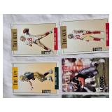 Lot of 11 Football Cards Featuring Brett Favre, Steve Young, Deion Sanders, Jerry Rice, and Barry Sanders