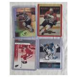 Lot of 4 Hockey Cards Featuring Mikael Renberg, Evgeni Nabokov, Sandis Ozolinsh, and Sergei Fedorov