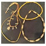 Four Gold Tone Beaded Necklaces