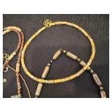 Four Gold Tone Beaded Necklaces