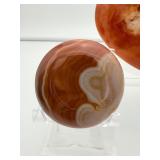 Polychrome Jasper Polished lot of 3: heart 340 gm./12 oz., round palmstone 185 gm./6.5 oz., round palmstone 116 gm./4.1 oz.