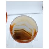 Polychrome Jasper Polished lot of 3: heart 340 gm./12 oz., round palmstone 185 gm./6.5 oz., round palmstone 116 gm./4.1 oz.