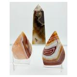Carnelian 3-piece polished lot: obelisk 267 gm/9.4 oz., banded flames 182 gm./6.4 oz., 122 gm./4.3 oz.