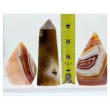 Carnelian 3-piece polished lot: obelisk 267 gm/9.4 oz., banded flames 182 gm./6.4 oz., 122 gm./4.3 oz.