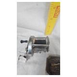 Direct Drive Shakespere Reel & 1977 Indiana Metal Craft Gun Belt Buckle