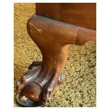 Antique Wood-Trimmed Sofa with Carved Paw Feet and Accent Pillows