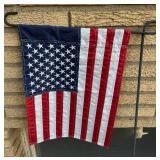 Outdoor Decor Lot with Doormat, Flag Stand, Planter, and Garden Spinner