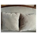 Antique Wood-Trimmed Sofa with Carved Paw Feet and Accent Pillows