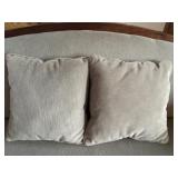 Antique Wood-Trimmed Sofa with Carved Paw Feet and Accent Pillows