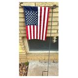 Outdoor Decor Lot with Doormat, Flag Stand, Planter, and Garden Spinner