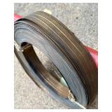 Red Metal Pipe Frame Clothing Stand and Roll of Perforated Metal