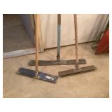 Three Concrete Rakes with Wooden Handles