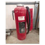 Older Fire Extinguisher with Hose and Nozzle