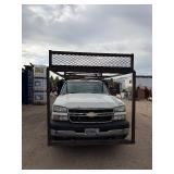 2007 White Chevy 3500 Diesel truck, flatbed with side rails, rack extending over the cab