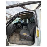 2007 White Chevy 3500 Diesel truck, flatbed with side rails, rack extending over the cab