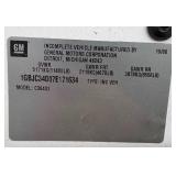 2007 White Chevy 3500 Diesel truck, flatbed with side rails, rack extending over the cab