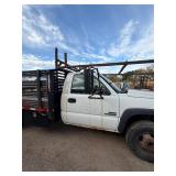 2007 White Chevy 3500 Diesel truck, flatbed with side rails, rack extending over the cab